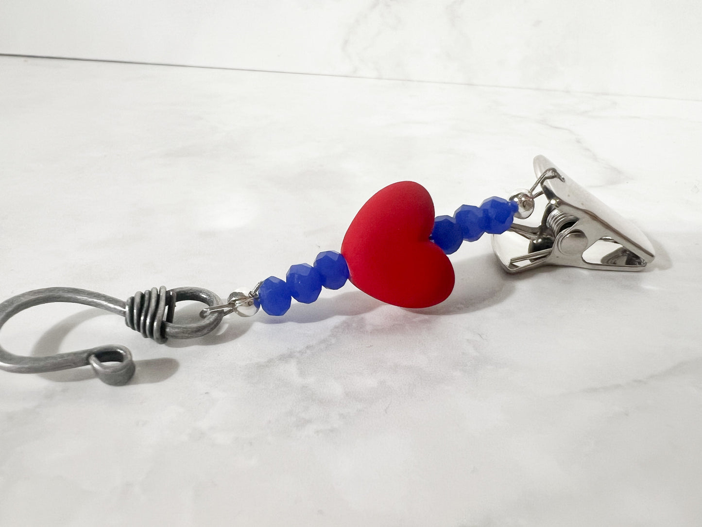 red and blue portuguese knitting pin