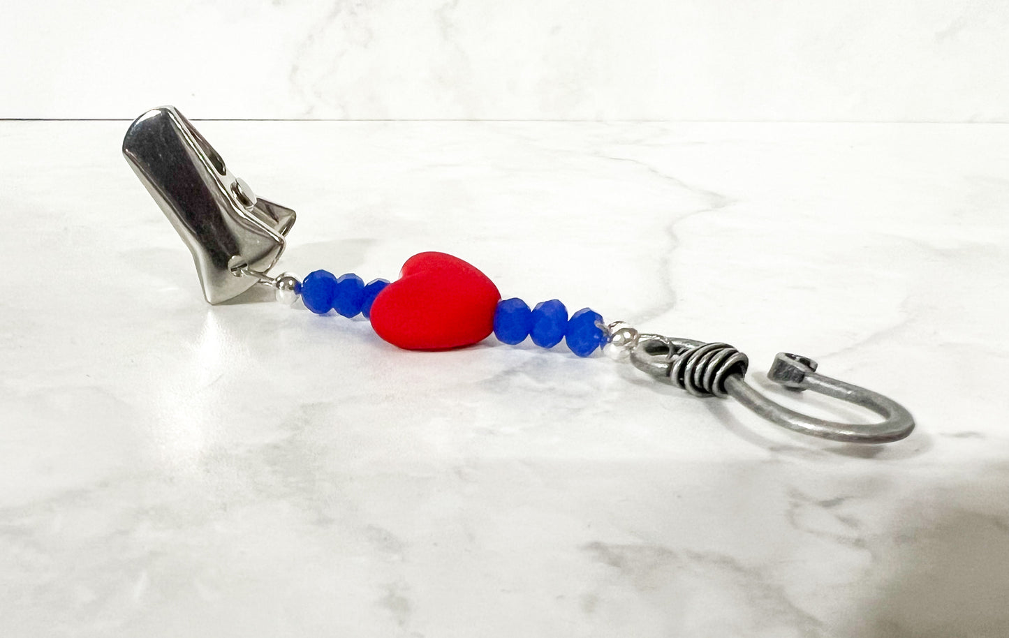 red and blue portuguese knitting pin
